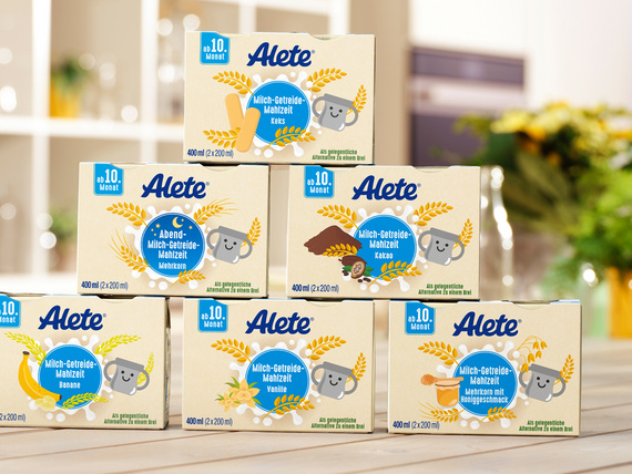 Alete Milchgetreide-Mahlzeiten gestapelt auf einem Holztisch