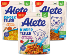 Verpackungen von Alete Kindertellern, einschließlich Risotto mit Kürbis und Ratatouille mit Couscous, für Kinder ab 1 Jahr.