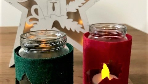 Windlichter mit weihnachtlichem Motiv aus grünem und rotem Filz
